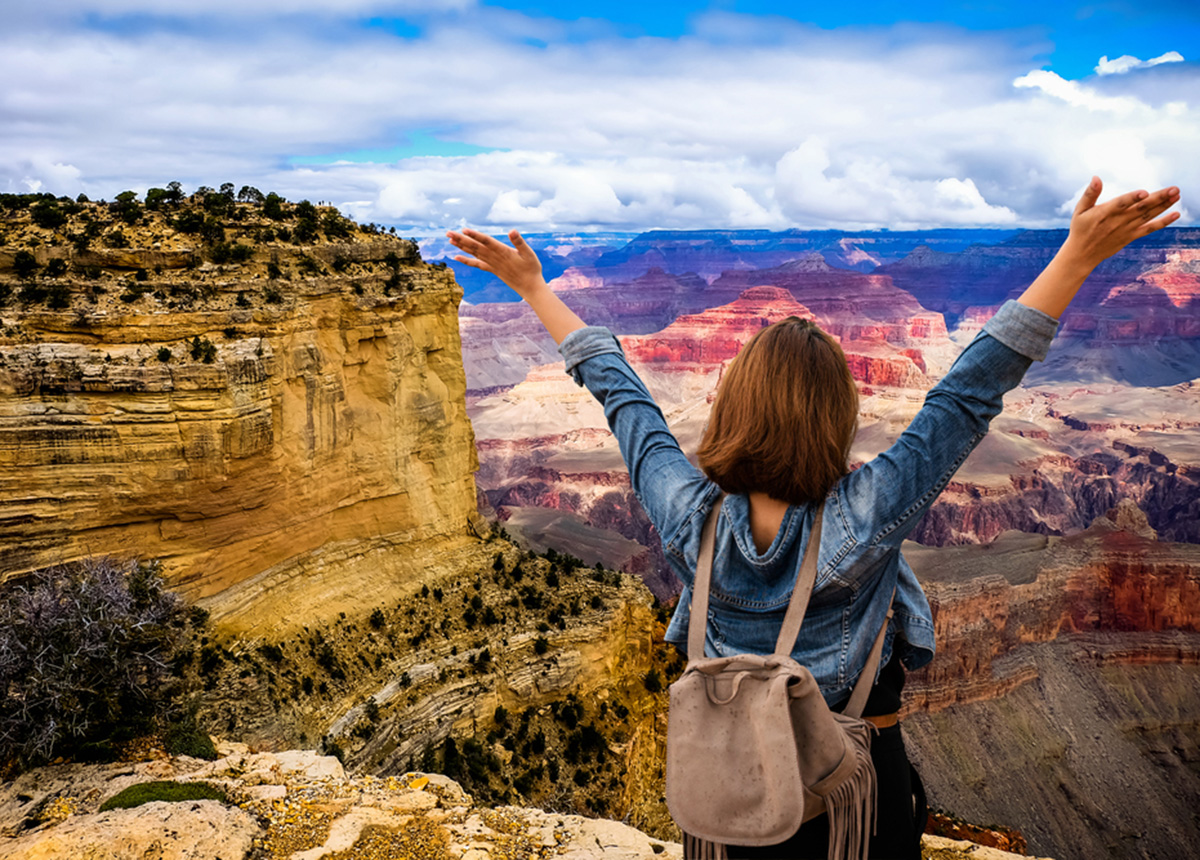 Woman Tourist Overlooks Grand Canyon