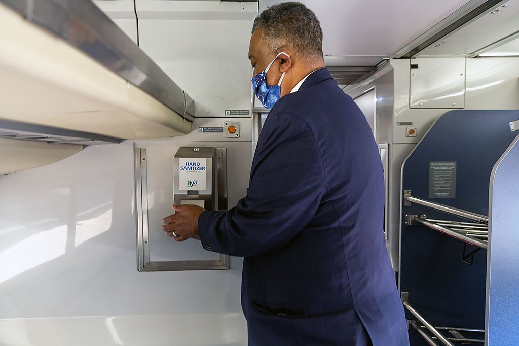 Customer using onboard hand sanitizer gel.