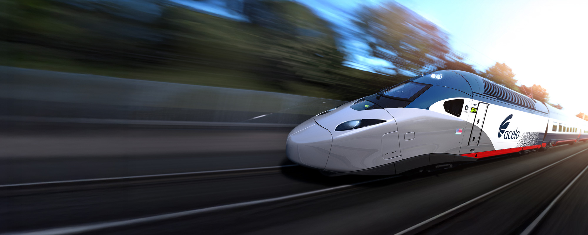 next-gen acela train moving fast through scenic route