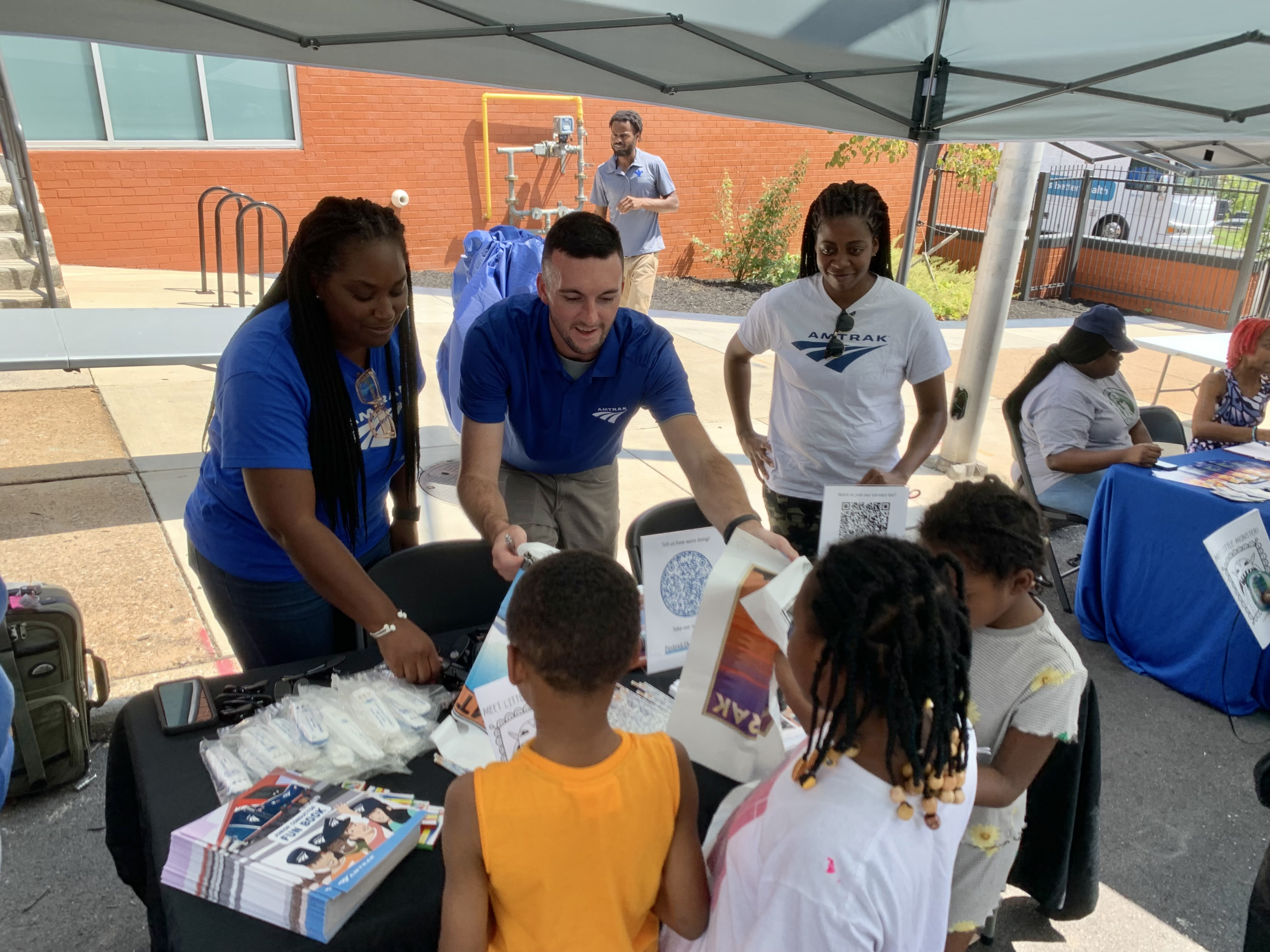 Amtrak employees gift swag to schoolchildren