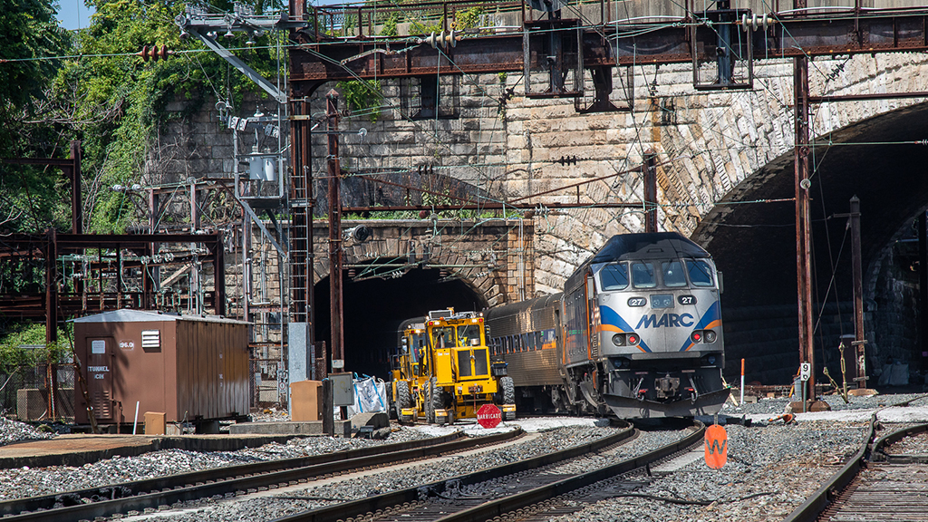 A train comes through the Frederick Douglass Tunnel
