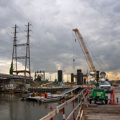 Cranes and other construction equipment at the Portal North Bridge project site