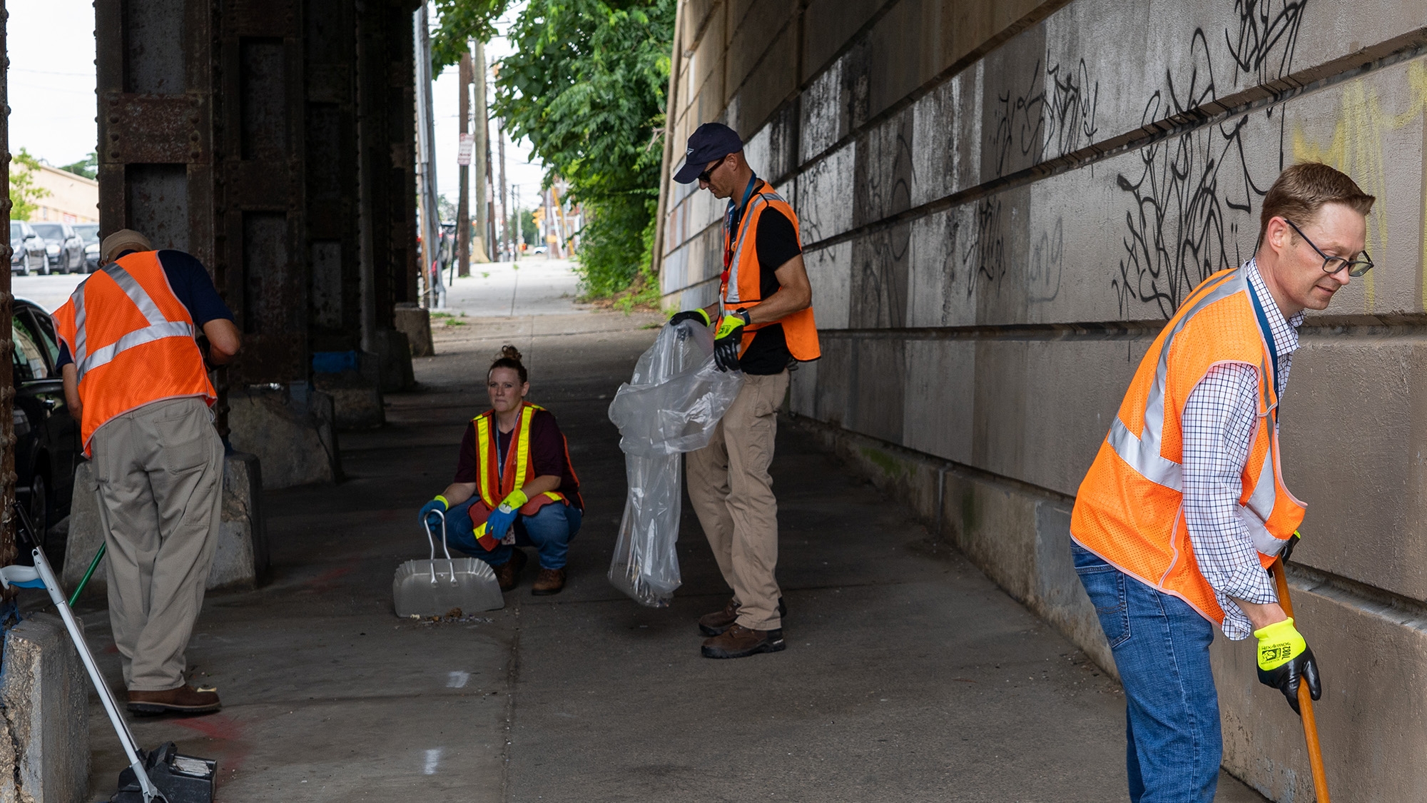 Amtrak employees clean up a West Baltimore tunnel