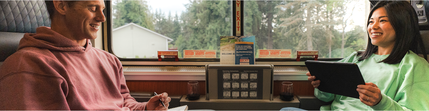 happy-couple-looking-out-window-in-amtrak-roomette