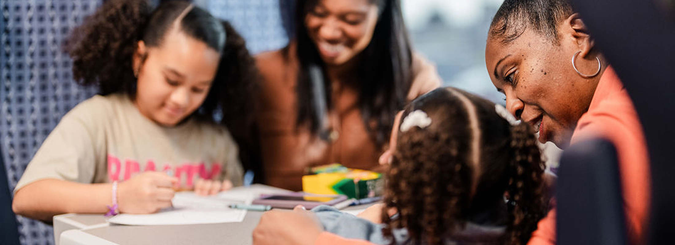 two-girls-coloring-on-amtrak-with-their-mothers