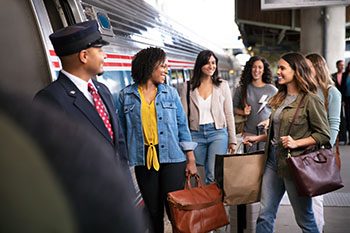 Friends with shopping bags on platform
