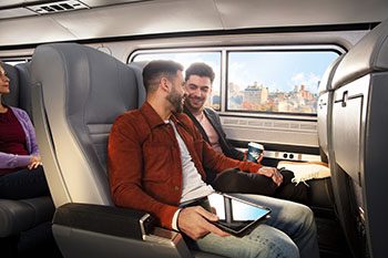 Male couple sitting together on board