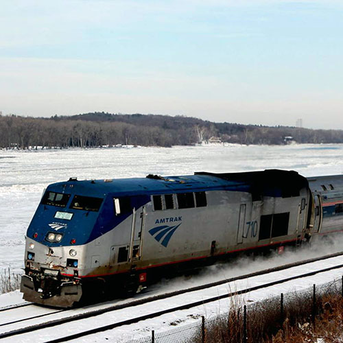 Amtrak Adirondack train rolling through snow