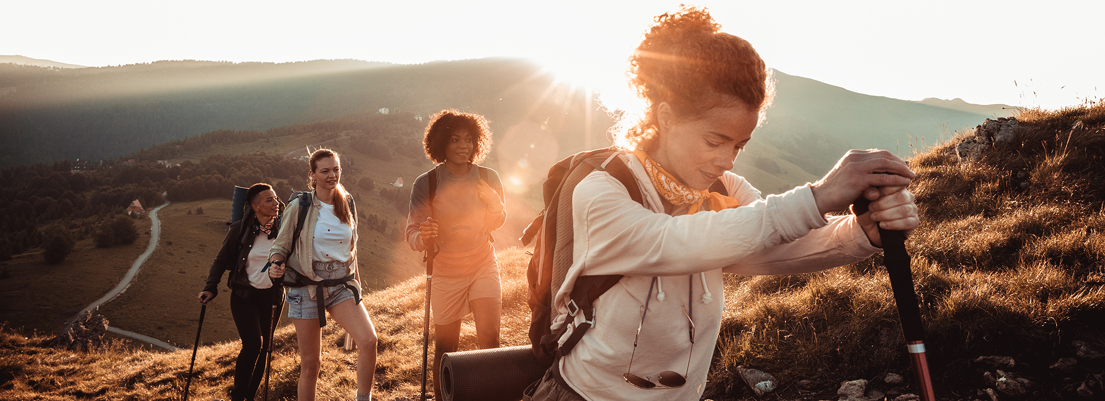 Close up of a group of friends hiking in the mountains