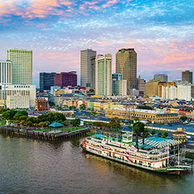 Pink and blue skies float above New Orleans's skyline. 